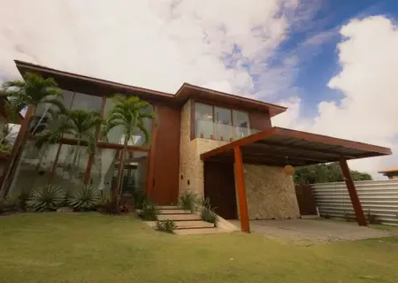 Stone and timber residences among palms at Riviere Noire