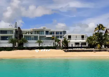 White beach house on the lagoon at Trou aux Biches