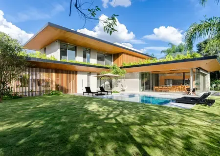 Contemporary villa with a lap pool and lawn in Black River